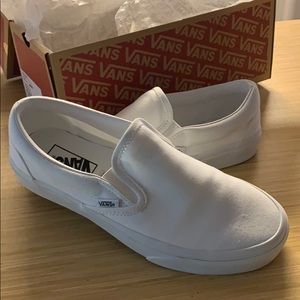 Vans white slip ons